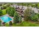 Expansive estate featuring a pool, lush landscaping, and architectural details, offering a private oasis at 4030 E Forbes Ct, Greenwood Village, CO 80121