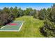 Spacious backyard featuring a well-maintained basketball court and sprawling green lawn perfect for recreation at 4030 E Forbes Ct, Greenwood Village, CO 80121