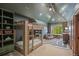 bedroom with a bunkbed, built-in shelving, and a window providing natural light at 4030 E Forbes Ct, Greenwood Village, CO 80121