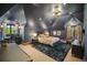 Comfortable bedroom featuring a vaulted ceiling and dark paint at 4030 E Forbes Ct, Greenwood Village, CO 80121