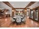 Dining area with stylish chairs and a fireplace feature in an open-concept home at 4030 E Forbes Ct, Greenwood Village, CO 80121
