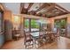Elegant dining room featuring hardwood floors, a decorative ceiling, and a large window with a view of the outdoors at 4030 E Forbes Ct, Greenwood Village, CO 80121