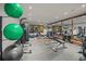 Spacious home gym with mirrors, exercise equipment, punching bag and fitness balls at 4030 E Forbes Ct, Greenwood Village, CO 80121