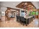 Open kitchen area with a large island, stone floors, and views of adjacent rooms at 4030 E Forbes Ct, Greenwood Village, CO 80121