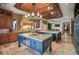 Gourmet kitchen with custom cabinetry, a large island, and professional-grade appliances at 4030 E Forbes Ct, Greenwood Village, CO 80121