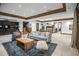 Spacious living room with wood beam ceilings, fireplace, and stylish decor at 4030 E Forbes Ct, Greenwood Village, CO 80121