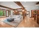 Expansive living room boasts hardwood floors and impressive wood beam architecture at 4030 E Forbes Ct, Greenwood Village, CO 80121