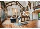 Cozy formal living room featuring hardwood floors, a fireplace, and elegant lighting at 4030 E Forbes Ct, Greenwood Village, CO 80121