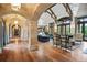 Spacious living area with hardwood flooring, arched entryways, and chandeliers at 4030 E Forbes Ct, Greenwood Village, CO 80121