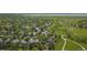 A scenic aerial view of a suburban neighborhood and the community's green park and trails near Standley Lake at 9605 Carr St, Broomfield, CO 80021
