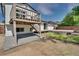 Backyard featuring a deck, gravel area, and fenced yard offering ample outdoor space at 9605 Carr St, Broomfield, CO 80021