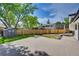Backyard with a large deck, storage shed, and spacious lawn perfect for outdoor activities at 9605 Carr St, Broomfield, CO 80021