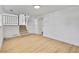 Finished basement area with neutral-toned flooring and staircase at 9605 Carr St, Broomfield, CO 80021