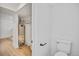 Clean bathroom with new toilet, modern paint, and access to storage at 9605 Carr St, Broomfield, CO 80021