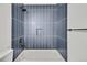 Nicely tiled bathroom features white tiles and tub, offering a clean and modern look at 9605 Carr St, Broomfield, CO 80021