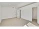 Empty bedroom with carpet flooring, and open doors to the hallway and a walk-in closet at 9605 Carr St, Broomfield, CO 80021