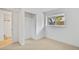 Bright bedroom features an open closet and neutral carpeting to complement the fresh white walls at 9605 Carr St, Broomfield, CO 80021