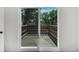 Sliding glass doors lead to a wooden deck with a view of trees and neighborhood at 9605 Carr St, Broomfield, CO 80021