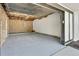 Spacious garage with freshly painted floor and walls is perfect for storage at 9605 Carr St, Broomfield, CO 80021