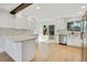 Bright, airy kitchen with stainless appliances, light wood floors, and an eat-in bar at 9605 Carr St, Broomfield, CO 80021