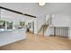 Open concept living room and kitchen with exposed beam and stainless appliances at 9605 Carr St, Broomfield, CO 80021