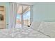 Light-filled bedroom with access to a balcony, featuring a comfortable bed and scenic city views at 955 Eudora St # 708E, Denver, CO 80220