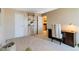 Neutral bedroom featuring shelving, a closet, and adjacent view into the kitchen at 955 Eudora St # 708E, Denver, CO 80220