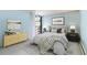 Stylish bedroom features a comfortable bed, a dresser, nightstands, and a large window with plenty of natural light at 955 Eudora St # 708E, Denver, CO 80220
