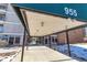 Building entrance with covered walkway and seating area at 955 Eudora St # 708E, Denver, CO 80220