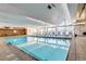 Indoor heated pool with lounge chairs at 955 Eudora St # 708E, Denver, CO 80220