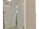Modern walk-in shower featuring white tiling, glass enclosure, and updated fixtures for a refreshing experience at 955 Eudora St # 708E, Denver, CO 80220