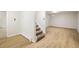 Finished basement showcases modern flooring, neutral walls, and a carpeted staircase at 4470 W Lakeridge Rd, Denver, CO 80219