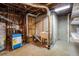 Unfinished basement area showcasing utility connections at 4470 W Lakeridge Rd, Denver, CO 80219