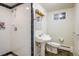 Basement bathroom features a vanity sink, a shower with black trim and a toilet at 4470 W Lakeridge Rd, Denver, CO 80219