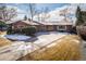 Charming home with a long driveway and landscaped front yard at 4470 W Lakeridge Rd, Denver, CO 80219