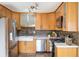 Modern kitchen featuring stainless steel appliances and quartz countertops at 4470 W Lakeridge Rd, Denver, CO 80219