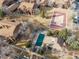 Aerial view of townhome community featuring swimming pool and community park at 540 S Forest St # 6-203, Denver, CO 80246