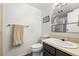 Bathroom featuring a toilet, vanity with sink, towel rack, and a framed glass shower at 540 S Forest St # 6-203, Denver, CO 80246