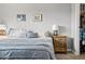 Bedroom with side tables, reading lamps, and closet space at 540 S Forest St # 6-203, Denver, CO 80246