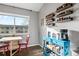 Bright dining area showcasing a wooden table, a coffee maker, and spice racks at 540 S Forest St # 6-203, Denver, CO 80246