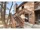Exterior entrance showing the unit number, staircase, and front door at 540 S Forest St # 6-203, Denver, CO 80246