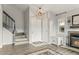 Bright entryway with stairs, wood flooring, fireplace and storage cabinet for organized and stylish living at 540 S Forest St # 6-203, Denver, CO 80246