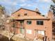 Exterior elevation of townhome featuring private balcony and well-maintained yard at 540 S Forest St # 6-203, Denver, CO 80246