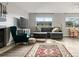 Bright living room featuring a fireplace, plush seating, and a dining area at 540 S Forest St # 6-203, Denver, CO 80246