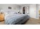 Spacious main bedroom with a queen bed, closet, side tables and plenty of storage at 540 S Forest St # 6-203, Denver, CO 80246