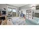Bright office with a sliding glass doors to balcony, desk, and shelving at 540 S Forest St # 6-203, Denver, CO 80246