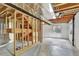 Spacious unfinished basement with concrete floor, exposed ceiling and wooden frame at 21541 Unbridled Ave, Parker, CO 80138