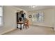 Neutral bedroom featuring a small desk, chair, and a bright window for plenty of natural light at 21541 Unbridled Ave, Parker, CO 80138