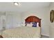 Bright bedroom features a full bed, closet and view of the hallway at 21541 Unbridled Ave, Parker, CO 80138