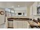 Modern kitchen open to the living space features stainless appliances and plenty of natural light at 21541 Unbridled Ave, Parker, CO 80138